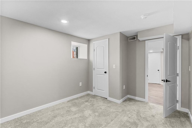 341 N 15th St, Kansas City, KS 66102 - unfurnished bedroom featuring light carpet and recessed lighting