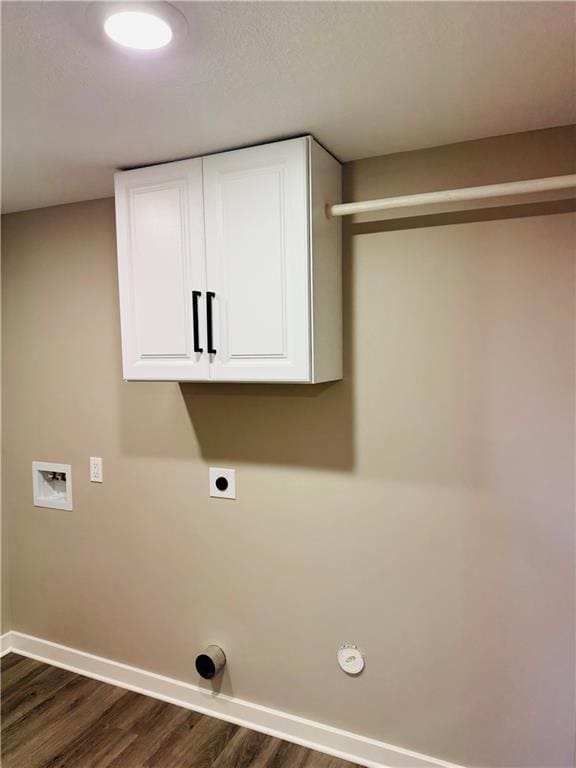 341 N 15th St, Kansas City, KS 66102 - laundry area featuring dark wood-style floors, washer hookup, hookup for an electric dryer, and cabinet space
