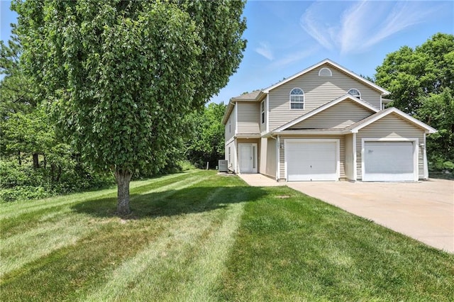 1501 SW Shelby Dr, Lees Summit, MO 64081 - view of front of home featuring driveway, a front lawn, and a garage