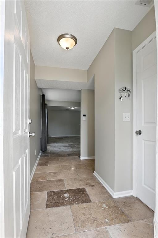 1501 SW Shelby Dr, Lees Summit, MO 64081 - hall featuring stone tile flooring and baseboards