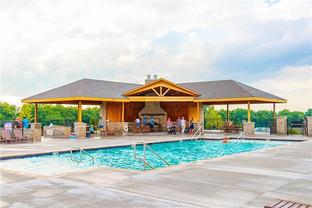 15389 W 173rd Ter, Olathe, KS 66062 - community pool featuring a fireplace and a patio