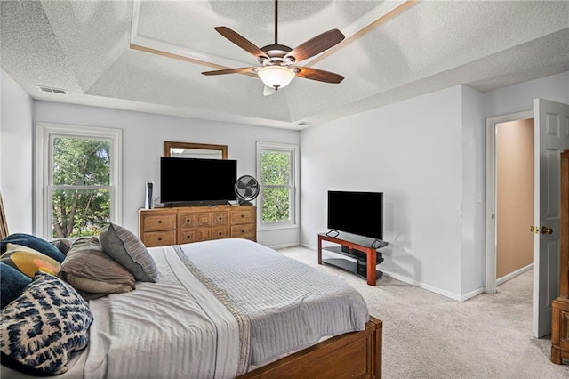 14510 W 138th Ter, Olathe, KS 66062 - bedroom featuring light colored carpet, multiple windows, a textured ceiling, and a ceiling fan
