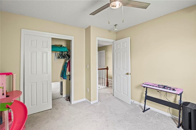 14510 W 138th Ter, Olathe, KS 66062 - bedroom featuring carpet flooring, a textured ceiling, and ceiling fan