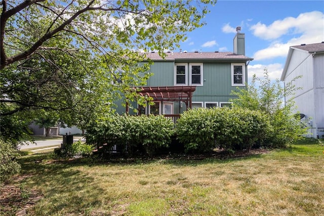 14510 W 138th Ter, Olathe, KS 66062 - back of house with a pergola, a chimney, and a lawn
