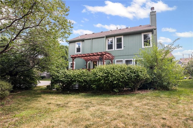 14510 W 138th Ter, Olathe, KS 66062 - back of property with a pergola, a chimney, and a lawn