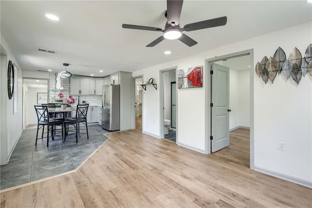 3100 N 56th St, Kansas City, KS 66104 - dining room featuring ceiling fan, light wood-type flooring, and recessed lighting