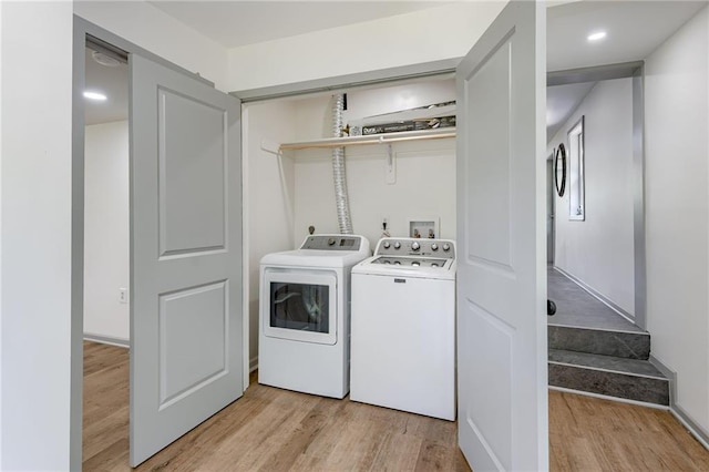 3100 N 56th St, Kansas City, KS 66104 - laundry area with washing machine and dryer and light wood-style flooring