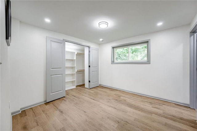 3100 N 56th St, Kansas City, KS 66104 - unfurnished bedroom with light wood finished floors, recessed lighting, and a closet