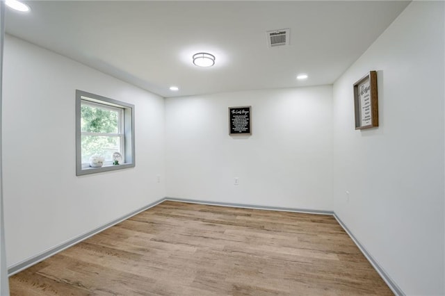 3100 N 56th St, Kansas City, KS 66104 - spare room with wood finished floors and recessed lighting