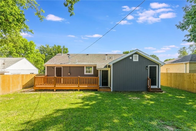 3414 Georgia Ave, Kansas City, KS 66104 - rear view of property with a fenced backyard, a deck, entry steps, and roof with shingles