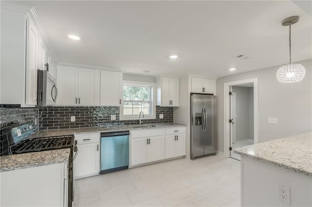3414 Georgia Ave, Kansas City, KS 66104 - kitchen featuring appliances with stainless steel finishes, light marble finish flooring, white cabinets, light stone counters, and recessed lighting