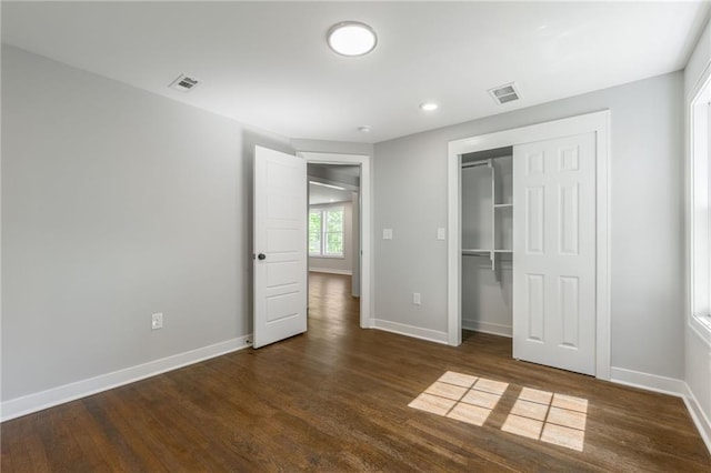 3414 Georgia Ave, Kansas City, KS 66104 - unfurnished bedroom featuring dark wood-style flooring, a closet, and recessed lighting