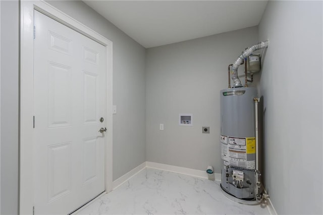 3414 Georgia Ave, Kansas City, KS 66104 - washroom with hookup for an electric dryer, gas water heater, washer hookup, and light marble finish floors