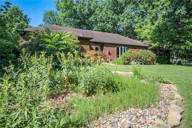 8224 Linden Dr, Prairie Village, KS 66208 - view of front of home featuring a front lawn and brick siding