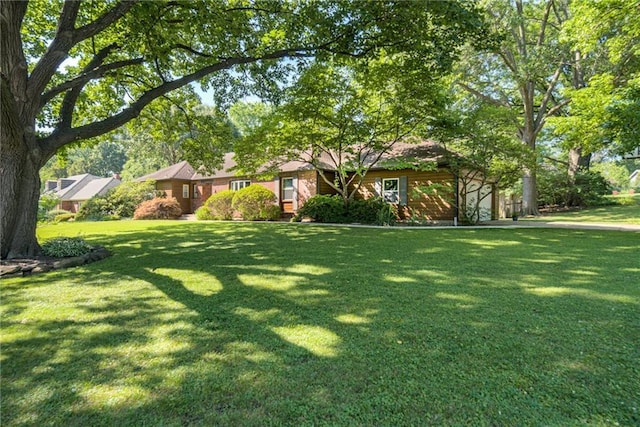 8224 Linden Dr, Prairie Village, KS 66208 - view of front of house with a front yard and a garage