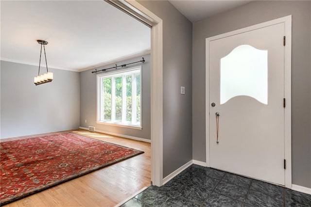8224 Linden Dr, Prairie Village, KS 66208 - entrance foyer featuring ornamental molding and dark wood finished floors