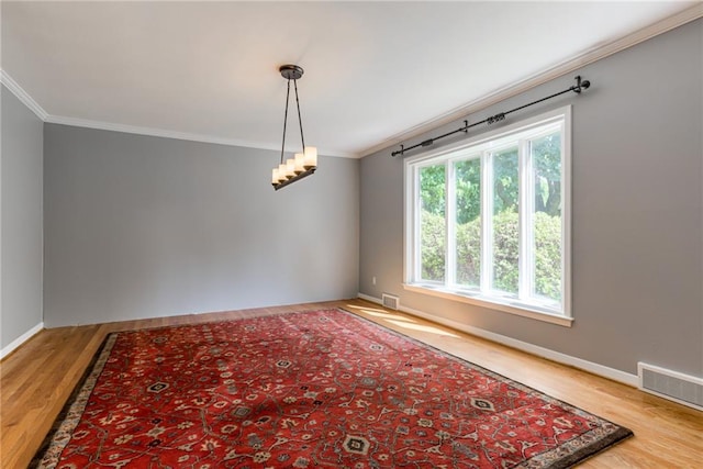 8224 Linden Dr, Prairie Village, KS 66208 - spare room featuring crown molding and wood finished floors