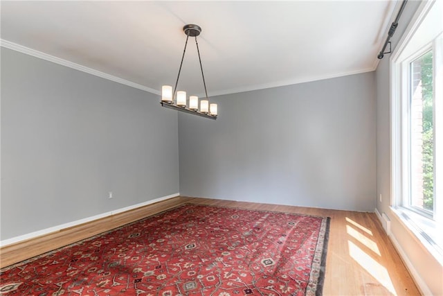 8224 Linden Dr, Prairie Village, KS 66208 - spare room featuring wood finished floors and ornamental molding