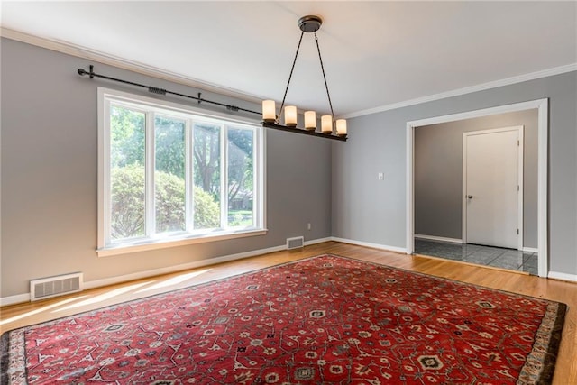 8224 Linden Dr, Prairie Village, KS 66208 - empty room with crown molding, wood finished floors, and a chandelier