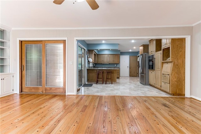 8224 Linden Dr, Prairie Village, KS 66208 - kitchen featuring light wood-style flooring, stainless steel appliances, ceiling fan, ornamental molding, and open floor plan