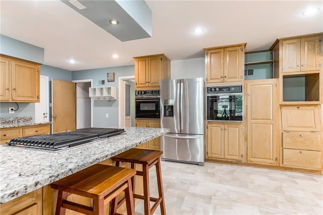 8224 Linden Dr, Prairie Village, KS 66208 - kitchen with appliances with stainless steel finishes, a breakfast bar area, light stone countertops, recessed lighting, and light brown cabinets