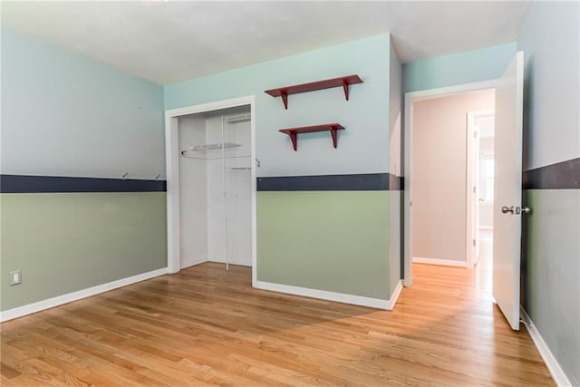 8224 Linden Dr, Prairie Village, KS 66208 - unfurnished bedroom featuring light wood finished floors and a closet