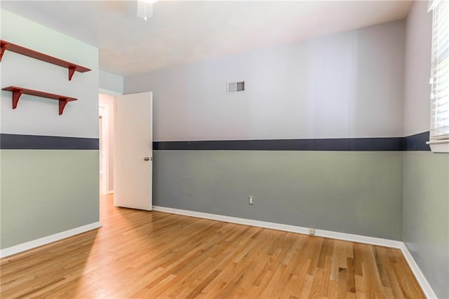 8224 Linden Dr, Prairie Village, KS 66208 - unfurnished room featuring wood finished floors and baseboards