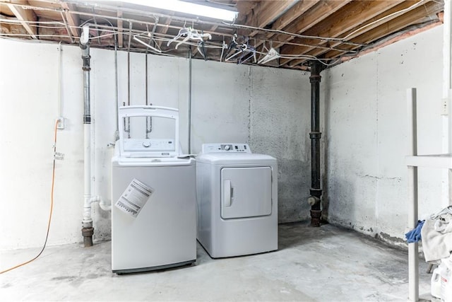 8224 Linden Dr, Prairie Village, KS 66208 - unfinished basement with washing machine and dryer