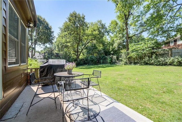 8224 Linden Dr, Prairie Village, KS 66208 - fenced backyard featuring outdoor dining space, a patio area, and grilling area
