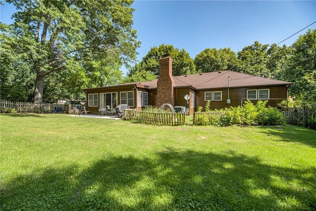 8224 Linden Dr, Prairie Village, KS 66208 - rear view of house featuring a fenced backyard, a chimney, and a patio