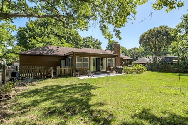 8224 Linden Dr, Prairie Village, KS 66208 - rear view of house with a patio, a fenced backyard, and a chimney