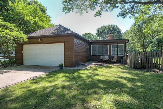 8224 Linden Dr, Prairie Village, KS 66208 - view of front facade with a garage, a chimney, and concrete driveway
