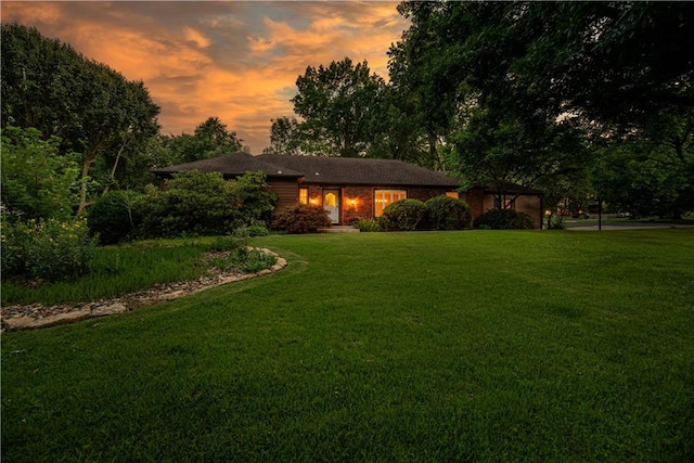 8224 Linden Dr, Prairie Village, KS 66208 - view of front facade with a lawn