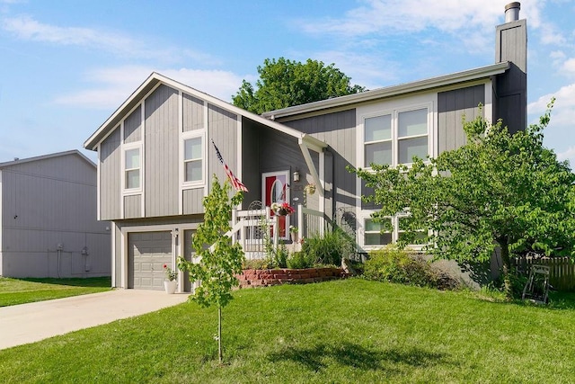 31241 W 172nd Ter, Gardner, KS 66030 - raised ranch featuring a garage, concrete driveway, a front lawn, and a chimney
