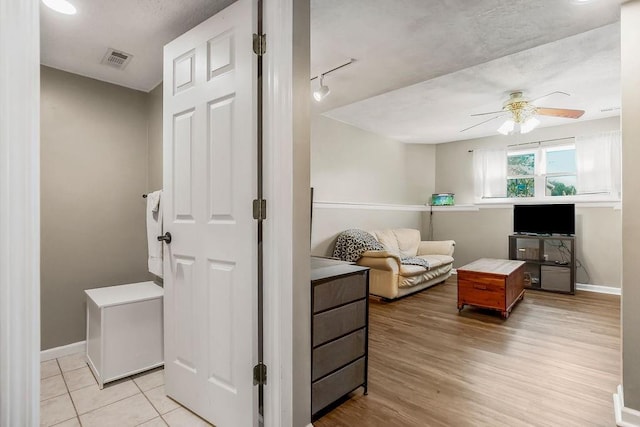 31241 W 172nd Ter, Gardner, KS 66030 - living area featuring a ceiling fan and light wood finished floors
