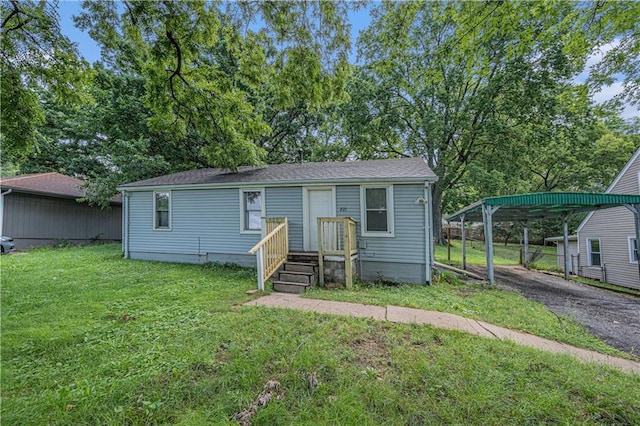 221 S High St, Independence, MO 64054 - view of front of house featuring a front yard and a carport