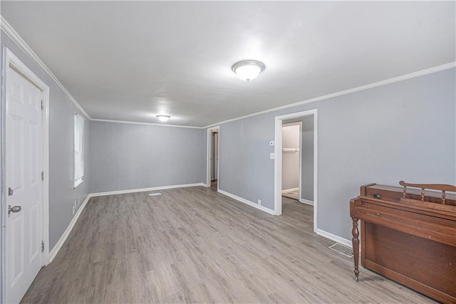 221 S High St, Independence, MO 64054 - unfurnished bedroom with ornamental molding and wood finished floors