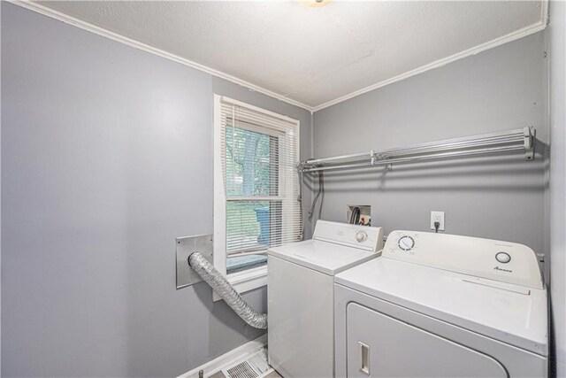 221 S High St, Independence, MO 64054 - laundry area with ornamental molding and washer and dryer
