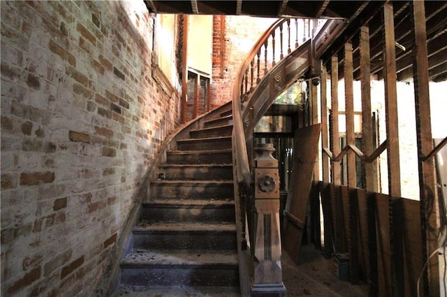 1705 Francis St, Saint Joseph, MO 64501 - stairs featuring brick wall
