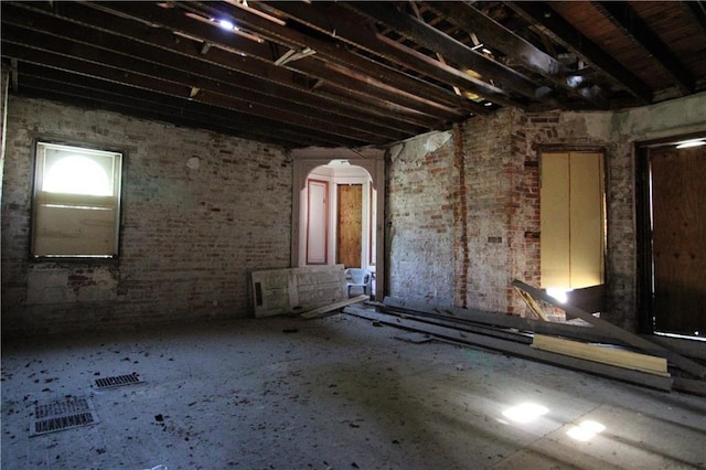 1705 Francis St, Saint Joseph, MO 64501 - miscellaneous room featuring arched walkways and brick wall