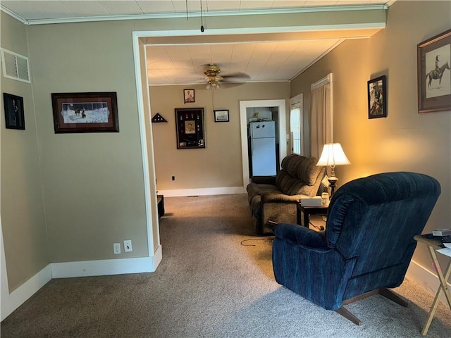 515 W 7th Ave, Garnett, KS 66032 - carpeted living area featuring ceiling fan and crown molding