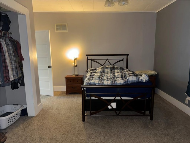 515 W 7th Ave, Garnett, KS 66032 - bedroom featuring carpet and crown molding