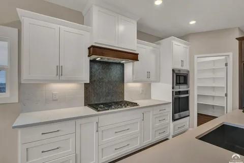 25446 W 91st Ter, Lenexa, KS 66227 - kitchen with stainless steel appliances, white cabinets, backsplash, and recessed lighting