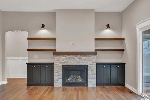 25446 W 91st Ter, Lenexa, KS 66227 - unfurnished living room with wood finished floors