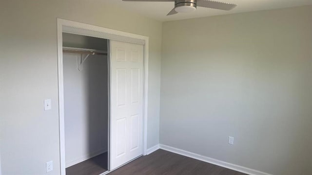 1106 S Mitchell St, Warrensburg, MO 64093 - unfurnished bedroom with dark wood finished floors, a closet, and a ceiling fan
