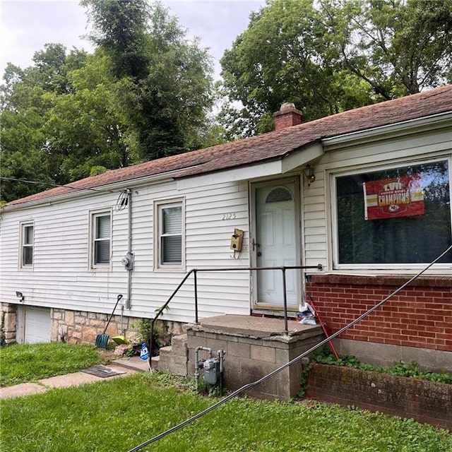2125 N 45th St, Kansas City, KS 66104 - view of front facade featuring a chimney