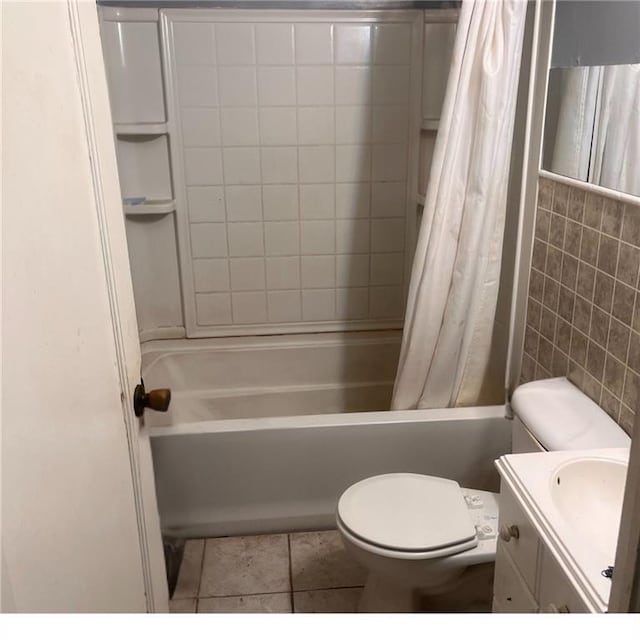 2125 N 45th St, Kansas City, KS 66104 - full bathroom featuring shower / bath combo, vanity, tile patterned flooring, and tile walls