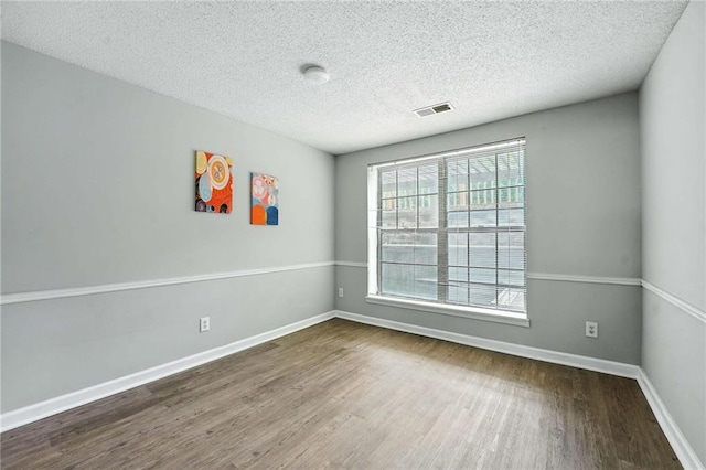 12704 W 110th Ter, Overland Park, KS 66210 - empty room with wood finished floors and a textured ceiling