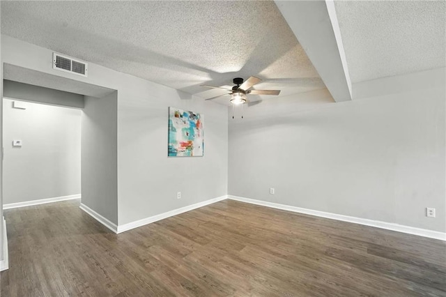 12704 W 110th Ter, Overland Park, KS 66210 - empty room with ceiling fan, dark wood-type flooring, and a textured ceiling