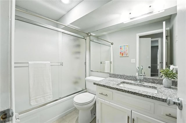 12704 W 110th Ter, Overland Park, KS 66210 - full bathroom featuring vanity, shower / bath combination with glass door, and tile patterned floors
